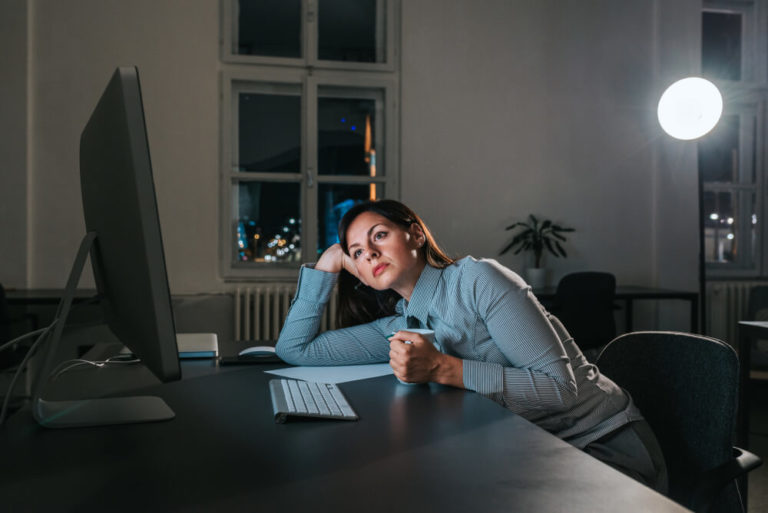 Stressed woman looking at a computer screen