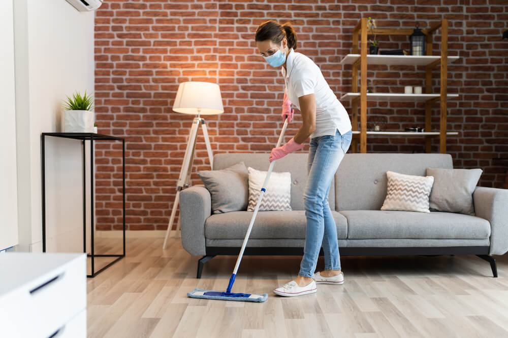 woman cleaning wooden floors